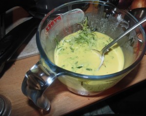 Adding the grated Courgette to the eggs for the filling of the Courgette, Saffron and Two Cheese Tart
