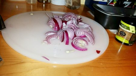 Cajun Salmon on a Mediterranean Sauce - Chopping the onions in half moons