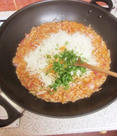 Theo Randall's Tomato Risotto - Stir in the butter to thicken and enrichen the sauce - Finish off with grated parmesan and finely chopped basil