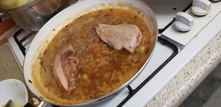 The pheasant breast warming in the sauce