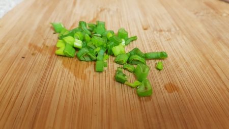 Finely chop some spring onions