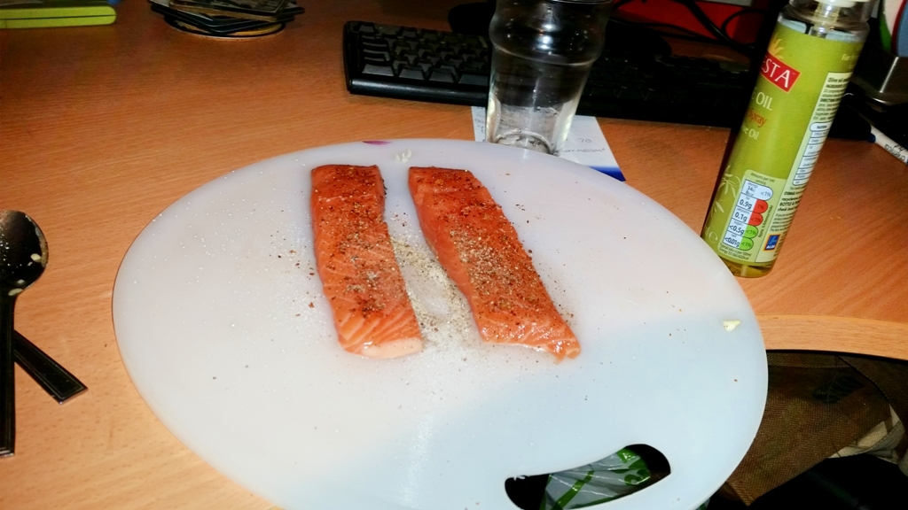 Cajun Salmon on a Mediterranean Sauce - Season the salmon with salt and pepper and spray oil over them