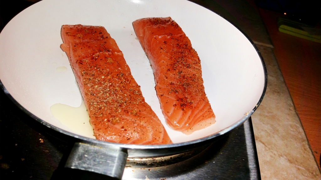 Cajun Salmon on a Mediterranean Sauce - Place the fish in a boiling hot pan