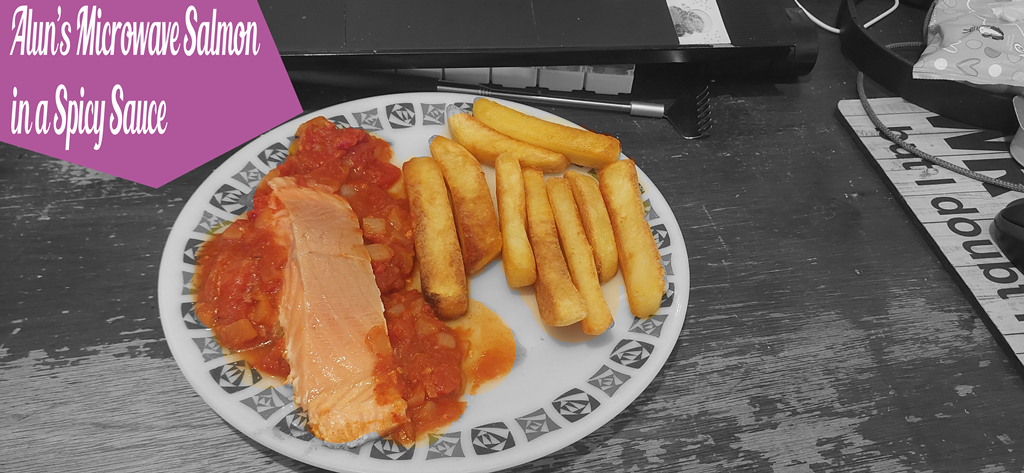 A Black and White picture of Alun’s Microwave Salmon in a Spicy Tomato Sauce served with McCain’s Triple Cooked Gastro Chips