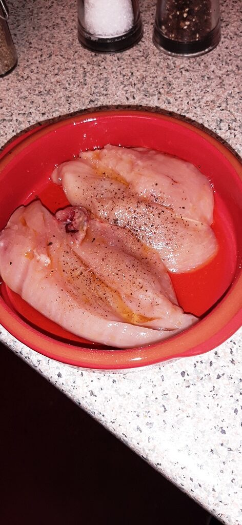 Two chicken breasts before they go in the oven